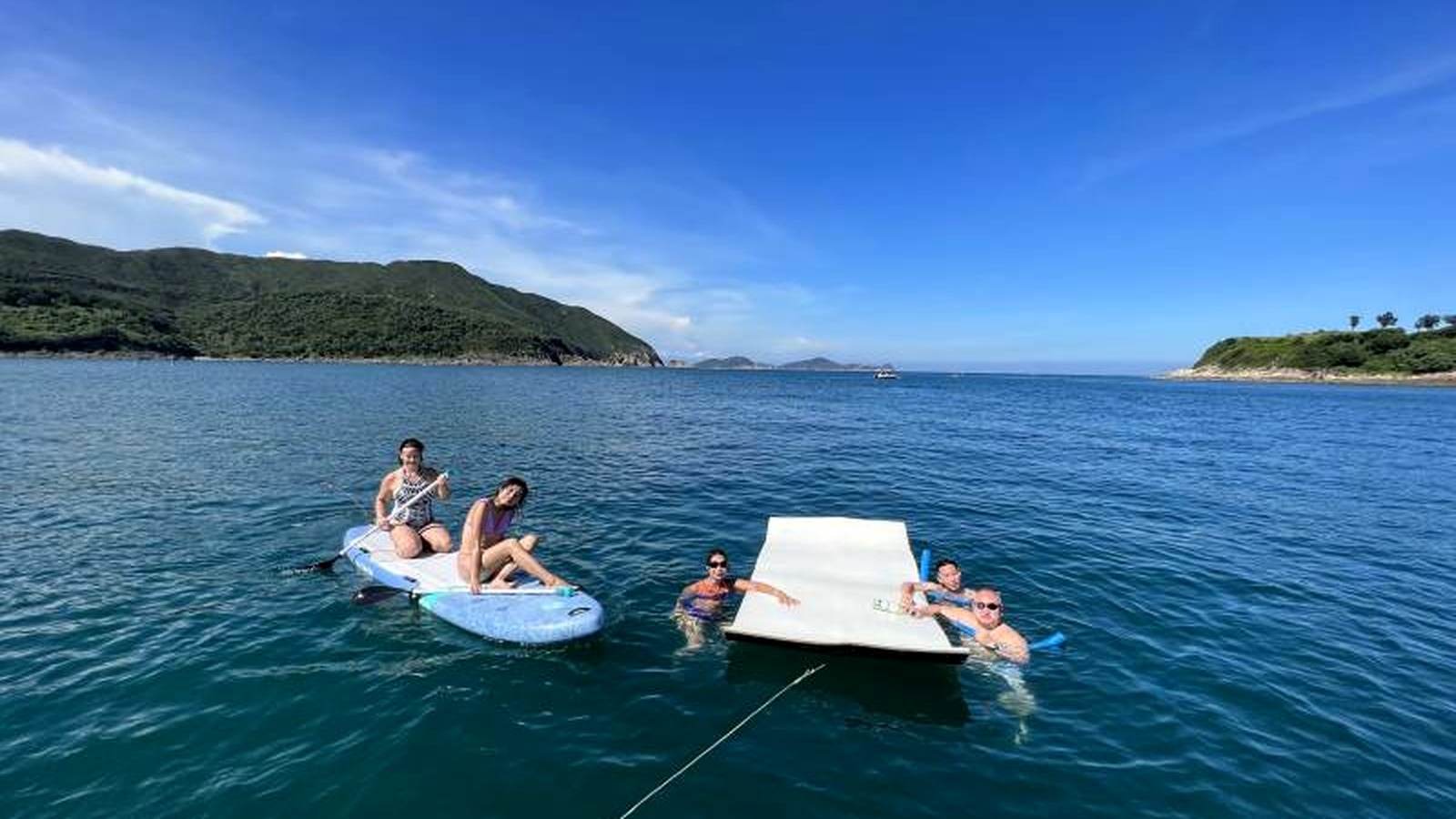 Guests enjoying water activities during a Lagoon 450F Sai Kung boatcation in Hong Kong