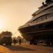 Luxury yacht undergoing organised maintenance at a modern shipyard