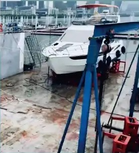 Work alongside a yacht in the Macau shipyard’s floating dock