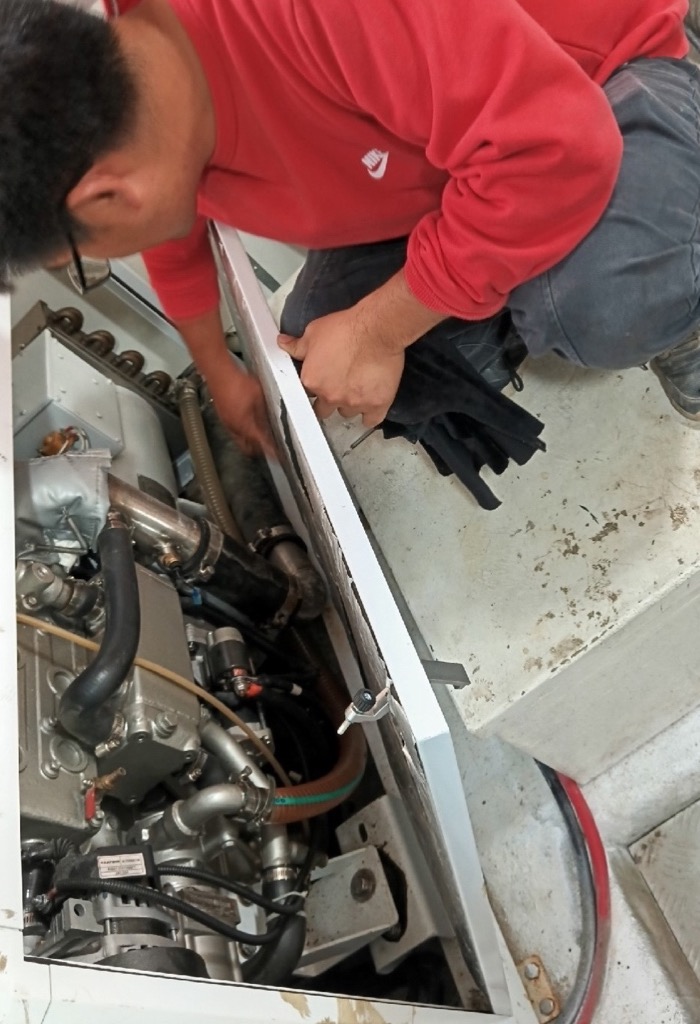 Technician inspecting onboard propulsion equipment